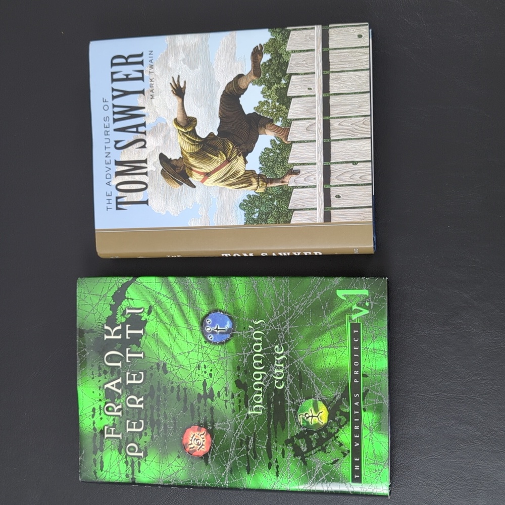 2 HARDBACK BOOKS - TOM SAWYER, HANGMAN'S CURSE